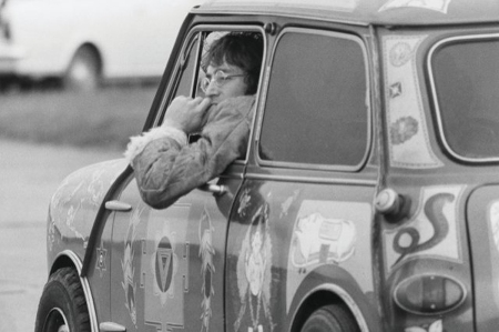John Lennon driving George Harrison's psychedelic Mini Cooper S during the filming of Magical Mystery Tour in 1967
